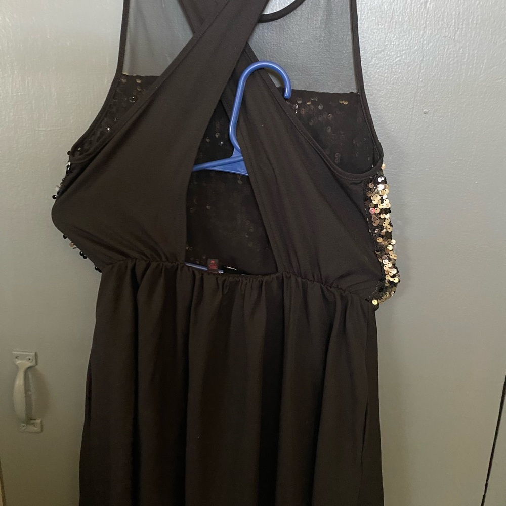 Black suit with glitter on the front with elastic at the waist completely new